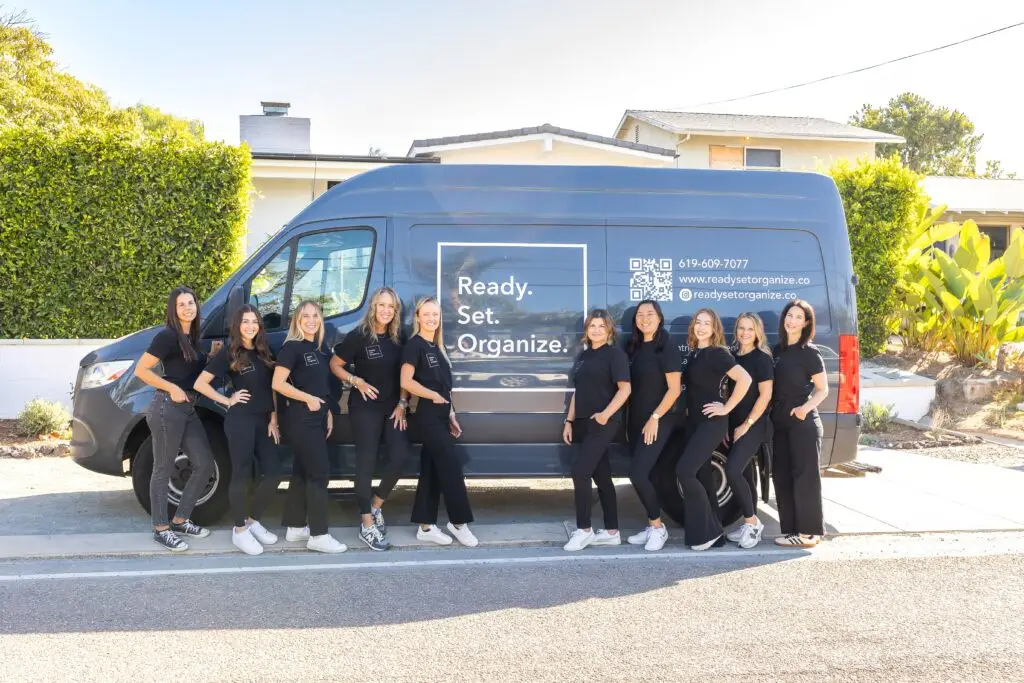 Team of organizers in front of Ready Set Organize van