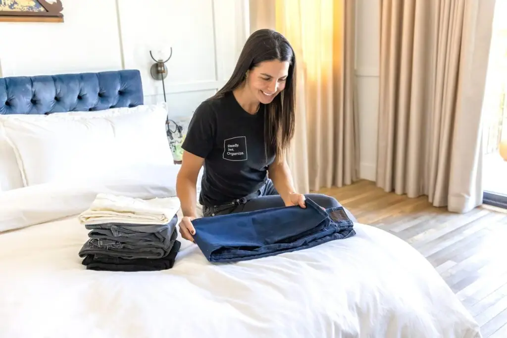 professional organizer folding and organizing clothes