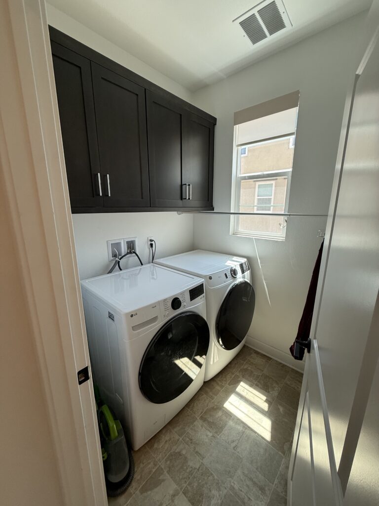 Organized laundry room office in San Marcos after Ready Set Organize decluttering service — clean and cleared surfaces